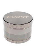Gunmetal EVRST metal herb grinder close-up with engraved lid logo and knurled grip edge