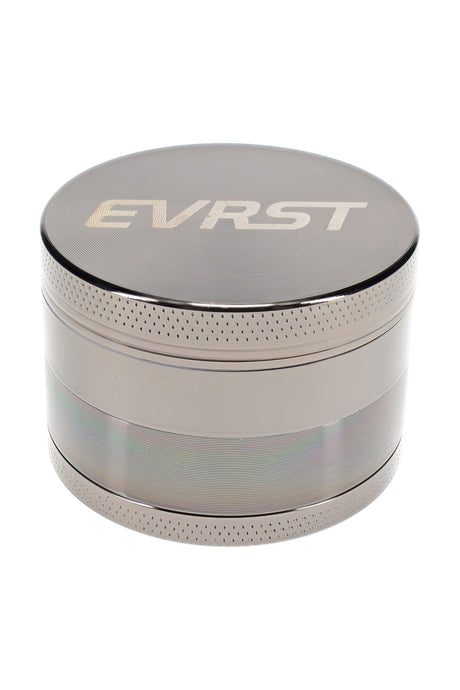 Gunmetal EVRST metal herb grinder close-up with engraved lid logo and knurled grip edge