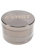 Polished silver EVRST herb grinder with engraved lid, stacked 4-part body, and grip texture