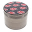 Assorted decal metal herb grinder parts with colorful leaf lid, screen, teeth, and scraper shown separately