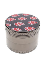 Assorted decal metal herb grinder parts with colorful leaf lid, screen, teeth, and scraper shown separately