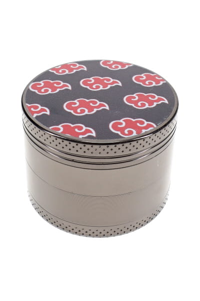 Assorted decal metal herb grinder parts with colorful leaf lid, screen, teeth, and scraper shown separately