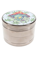 4-part metal herb grinder with mushroom alien decal lid and silver ribbed body on white background