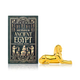 Side profile of Hemper Ancient Egypt Sphinx 5″ gold glass hand pipe beside ornate black and gold box, ready for display or gifting.