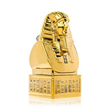 Three-quarter angle of Hemper Ancient Egypt XL gold glass bong highlighting etched hieroglyphic band around plinth-style base on white surface.