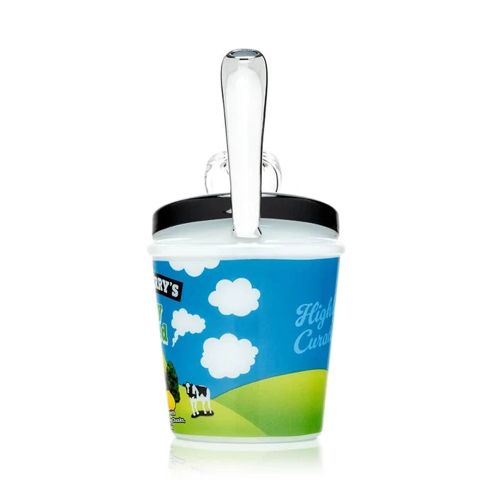 Angled HEMPER Fully Baked glass bong showing blue pint artwork, clear bowl, and glass straw mouthpiece