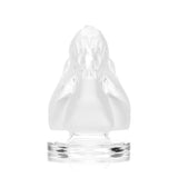 Front view of Hemper Jurassic Spark dinosaur skull mini bong with frosted snout, open jaw and clear pedestal base centered on white backdrop.