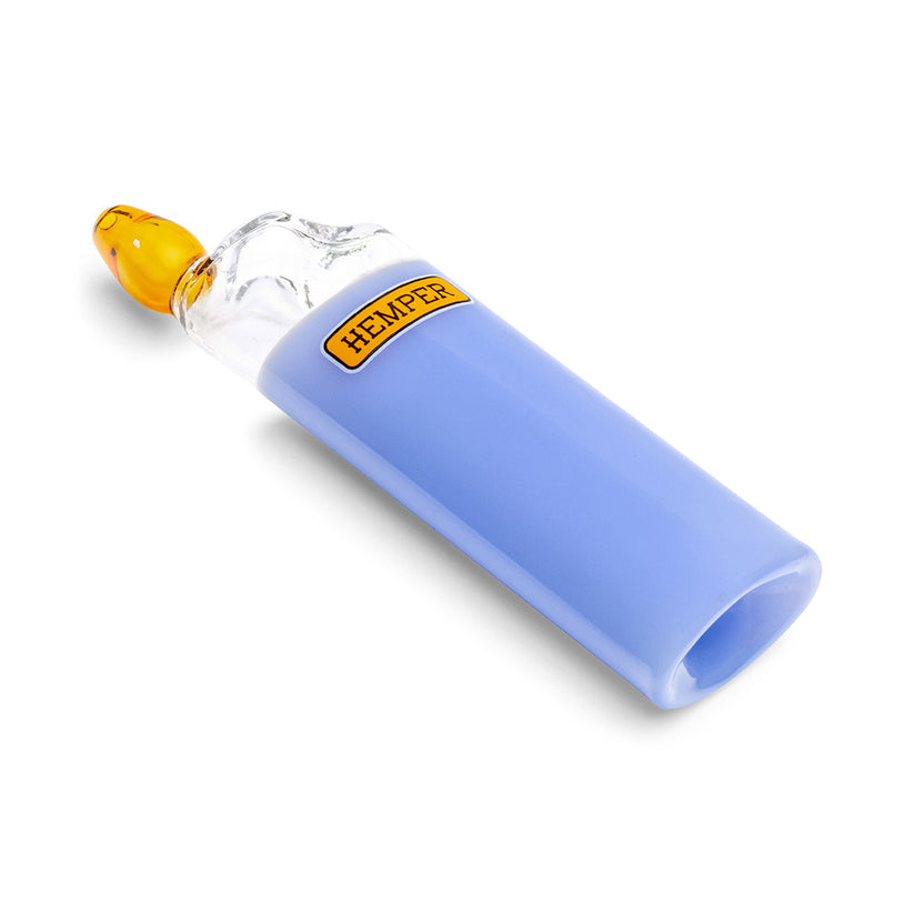 Angled view of Hemper Bowlman Lighter blue glass pipe lying on its side, highlighting the lighter body shape and amber mouthpiece.