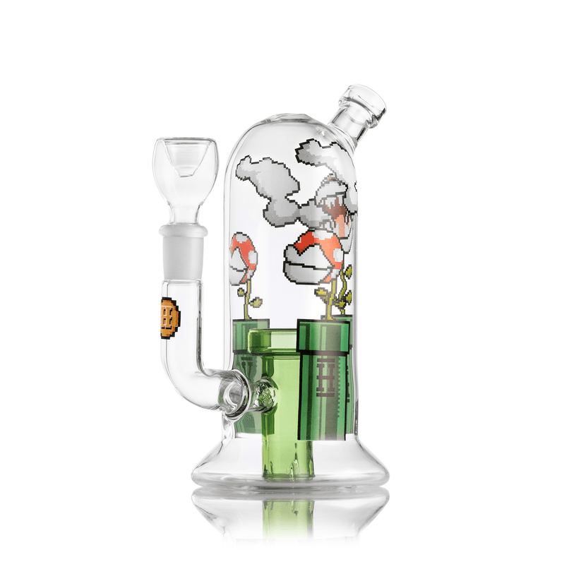 Angled side view of Hemper Gaming Flower 7″ glass bong showing dome-shaped chamber, green tube perc, and wraparound pixel clouds, flowers, and pipe design.