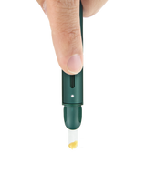 Pine Puffco Hot Knife held above concentrate with ceramic tip exposed and button visible