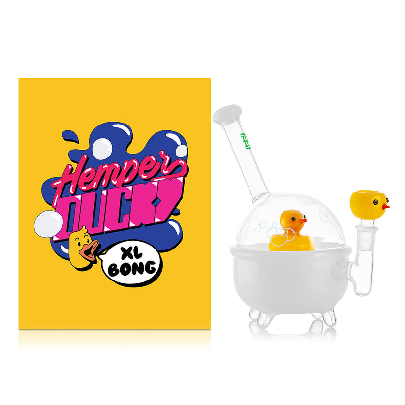 Hemper Ducky XL bathtub-style bong with yellow duck perc displayed next to bold yellow Ducky XL Bong packaging on white.