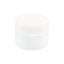 Side-angle view of small opaque white glass concentrate jar with threaded lid, showing compact squat profile against white backdrop