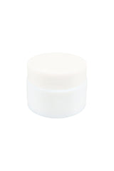 Side-angle view of small opaque white glass concentrate jar with threaded lid, showing compact squat profile against white backdrop