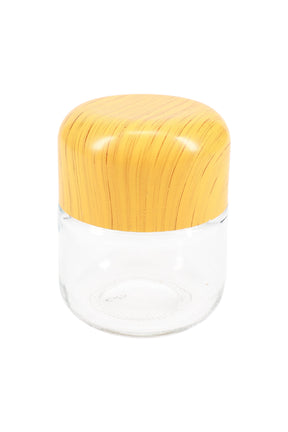 Small clear glass stash jar with rounded wood-grain tamper-evident lid, centered on white background, perfect for cannabis flower or edibles