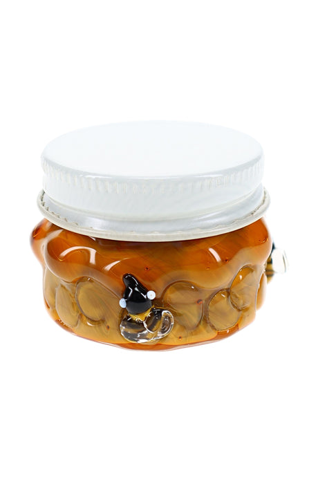 Amber honeycomb glass terp jar with white screw-top lid, bee accents, and compact 1½″ storage shape