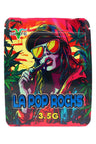 Neon red and teal 3.5 g mylar bag showing woman vaping with cap and mirrored shades, “LA Pop Rocks” label; ⅛ oz storage pouch.