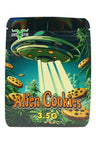Space-themed 3.5 g mylar bag with UFO beaming cookies over starry sky, “Alien Cookies” text; ⅛ oz storage pouch.
