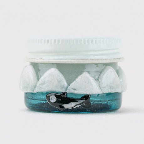 Rear view of Empire Glassworks arctic terp jar with sculpted orca detail and frosty glass band