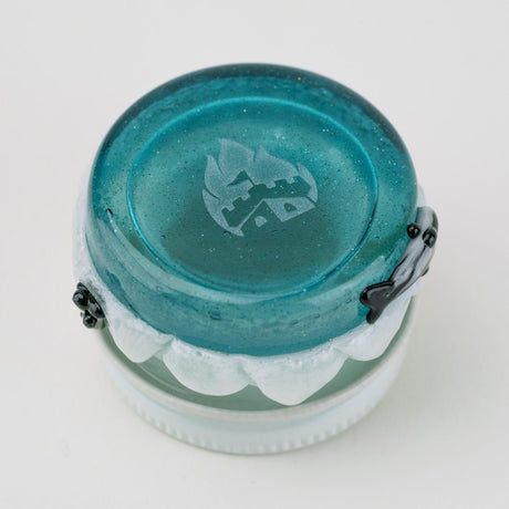 Bottom view of Empire Glassworks blue terp jar showing compact round base and handmade glass detail