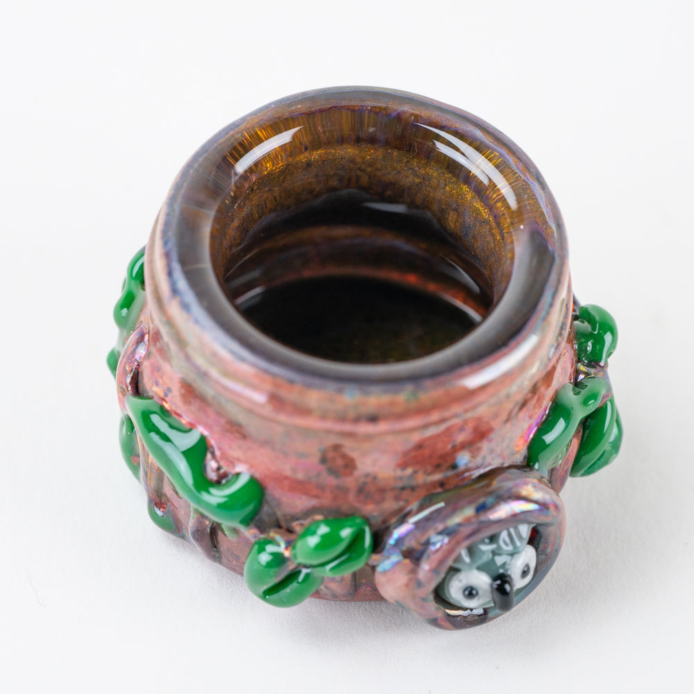 Empire Glassworks Hootie’s Forest concentrate jar with bark-style body and green leaf accents