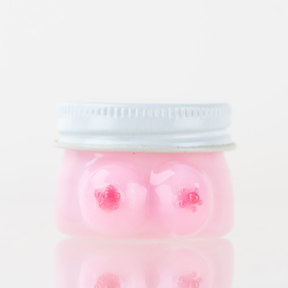 Empire Glassworks Boobies terp jar front view with pink glass body and silver fitted lid