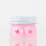 Empire Glassworks Boobies terp jar front view with pink glass body and silver fitted lid