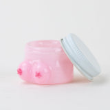 Open Empire Glassworks Boobies concentrate jar showing pink interior and removable silver lid