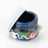 Open Empire Glassworks Across the Universe concentrate jar showing cosmic glass body and lid