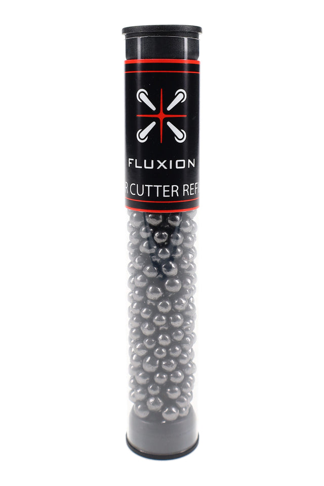 Flux Tar Cutter refill tube filled with activated carbon beads standing upright on white, black label with red trim visible