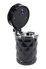 Open black diamond cup-holder ashtray showing blue LED light, hinged lid, and stainless inner bowl, angled white-background shot.