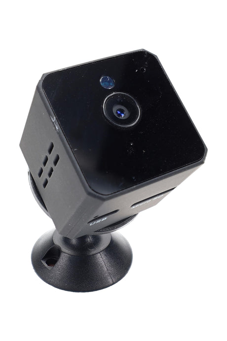 Cube-shaped mini 1080p motion-detect camera on magnetic swivel mount, angled front view on white background, USB and Micro SD slots visible