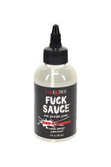 “Fuck Sauce” water-based personal lubricant in a 4-oz clear bottle with precision nozzle and black label, shown in a close-up retail product photo.