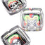 Square glass ashtray trio with reggae skull and jester designs in vivid Rasta colors, glossy white backdrop.