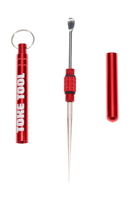 Disassembled red toke tool displaying metal scoop and sharp poker ends with threaded handle and keychain cap.