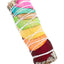 4″ white sage smudge stick wrapped in layered rainbow rose petals and tied with white string; compact aromatic bundle.