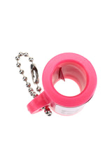 Close-up of pink EZ Splitz cutter showing the internal splitter blade inside the cylindrical opening with keychain attached.