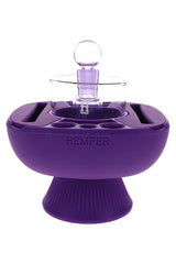 Purple Hemper IsoPlex concentrate station with matching carb cap and glass reservoir sitting on flared pedestal silicone base.