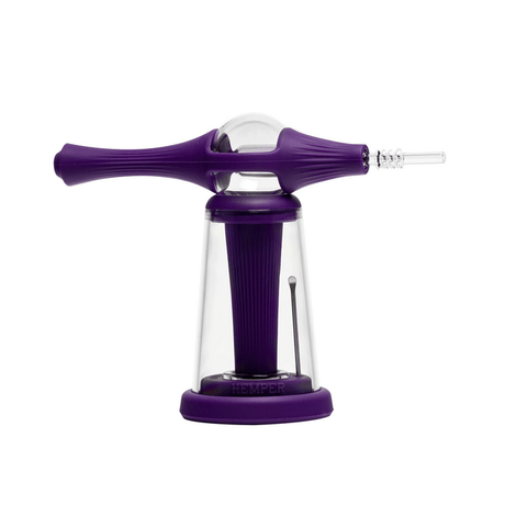 Purple dab straw laid across Vapor Station base with clear dome bubbler and included glass concentrate dish