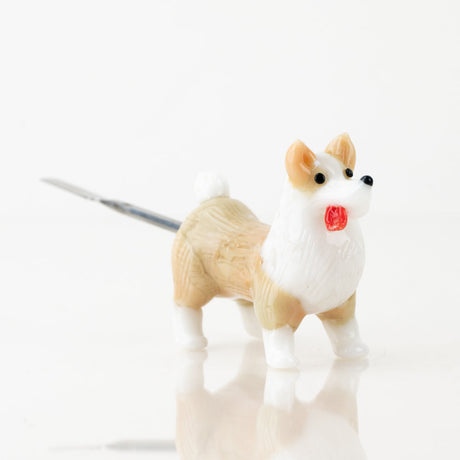 Empire Glassworks Corgi dabber side profile with tan glass dog body and slim tool tip