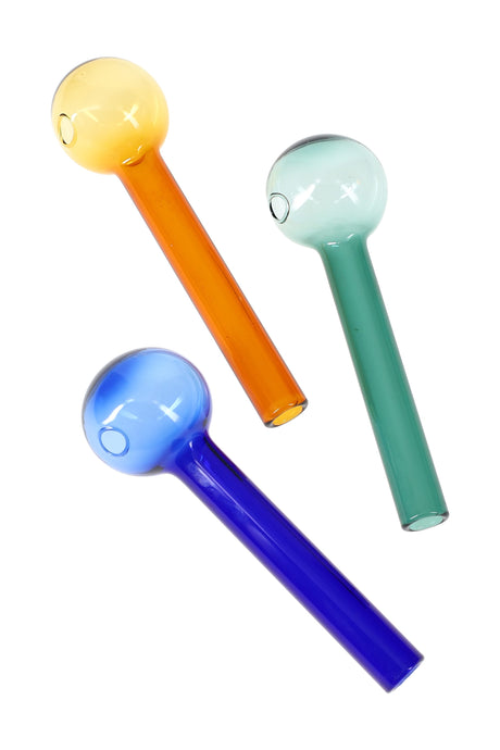 4-inch thick glass oil burner pipes in metallic blue, amber, and teal finishes with rounded bowls and straight stems, arranged diagonally on white background.