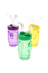 US-made colored glass cactus oil burner rig with textured body, bent mouthpiece, and round globe burner; multiple bright colors shown on white.