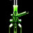 Green bottle-shaped mini oil burner rig with donut neck accents and angled straw mouthpiece, black background.