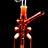Orange bottle oil burner rig highlighting clear burner dome and snug glass-on-glass connection, studio black background.