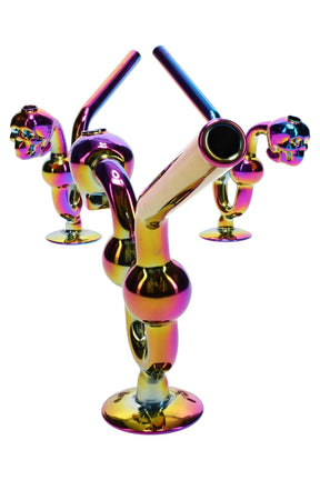 6″ rainbow metallic glass skull water-dog oil burner with angled mouthpiece and pedestal base; reflective multi-color finish, assorted colors shown.