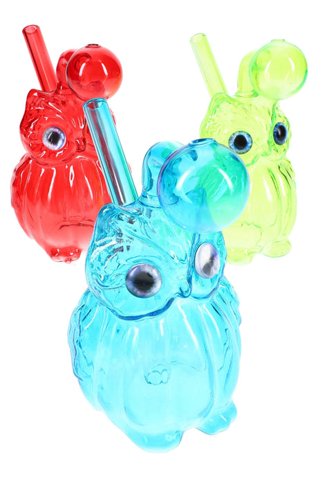 Assorted-color glass owl oil burner rig lineup, compact 4″ size with rounded bubble top and angled stem.