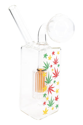 Single clear glass rasta leaf oil burner rig with colorful dome percolator, angled neck and compact 3.5″ height.