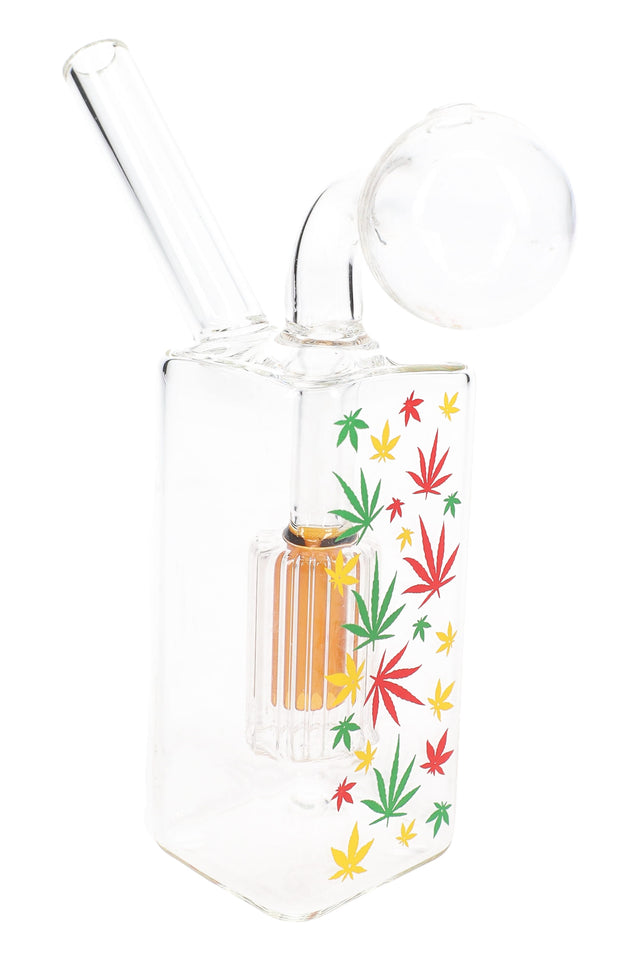 Single clear glass rasta leaf oil burner rig with colorful dome percolator, angled neck and compact 3.5″ height.