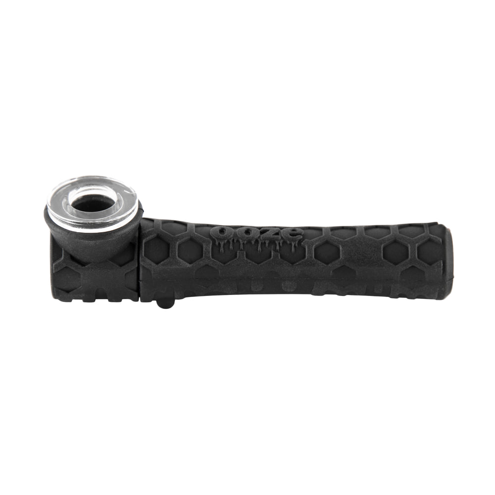 Black silicone chillum setup with clear glass mouthpiece insert and textured hex-pattern handle