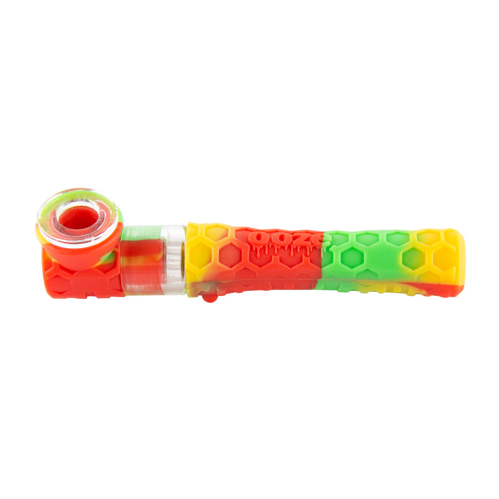 Rasta Ooze Piper silicone and glass hand pipe with red, yellow, and green hex-pattern body