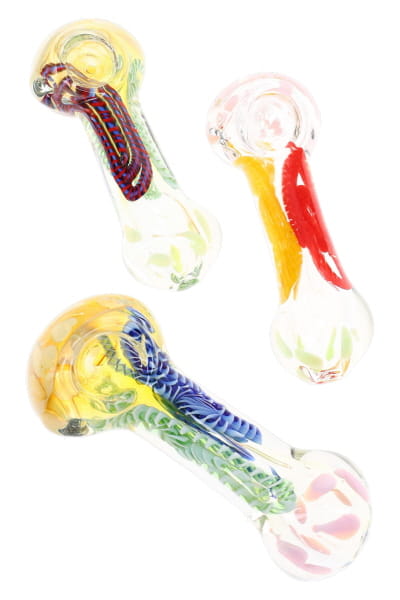 Three assorted color-changing glass spoon pipes with multicolor stripes and dot bowl accents